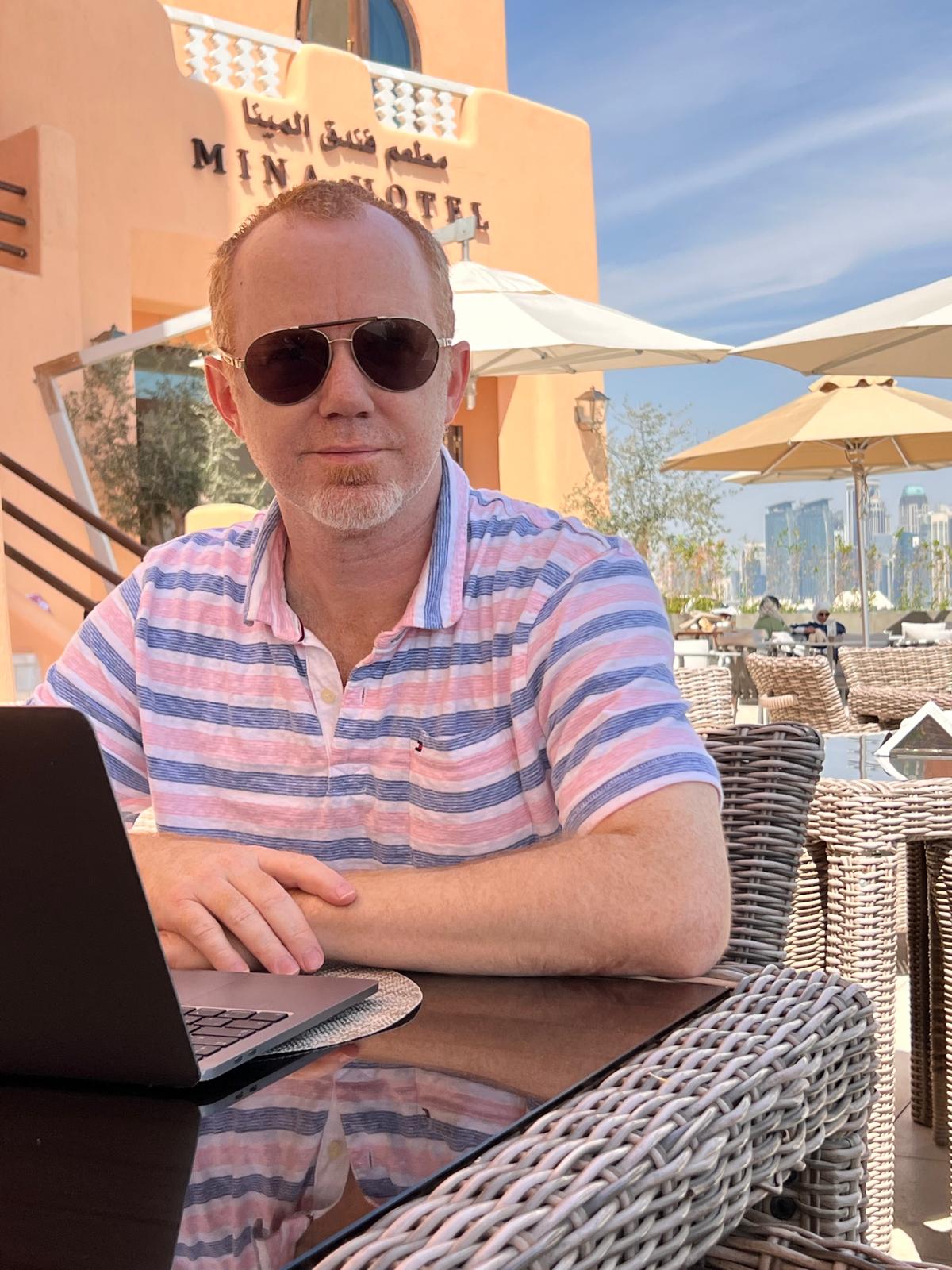 Jon Weldon working outside at Mina Hotel, Doha, Qatar
